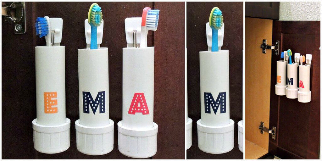 Soporte de cepillos personalizado: Tres recipientes cilíndricos rotulados con letras estampadas sostienen cepillos dentales de colores.
